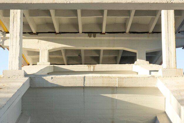 Bottom view of the structure of the bridge Fragment view of the road Road construction highway