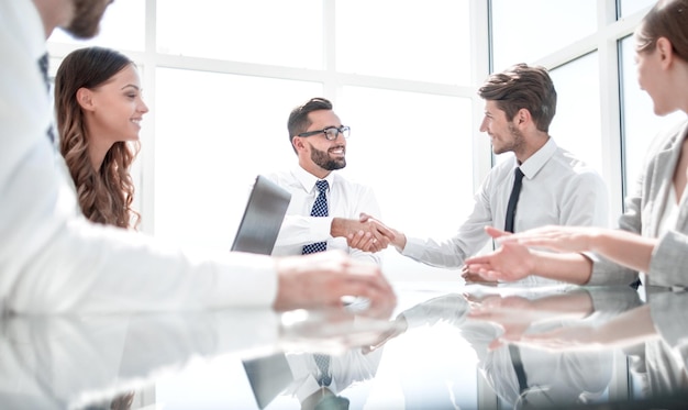 Bottom viewhandshake business partners over the Deskthe concept of cooperation