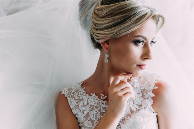 Boudoir of the bride. charming bride in the morning in a negligee prepares for the celebration