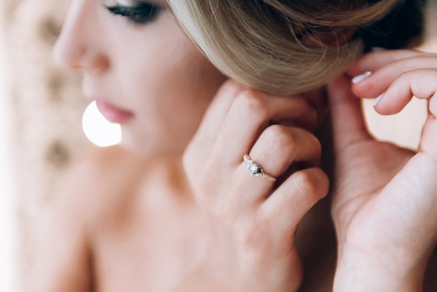 Boudoir of the bride. charming bride in the morning in a negligee prepares for the celebration