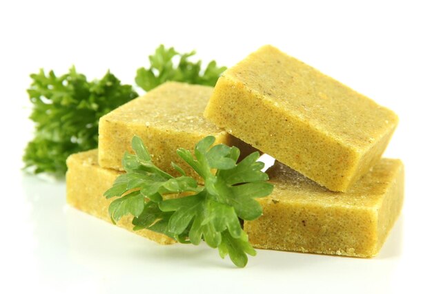 Bouillon cubes with parsley isolated on white