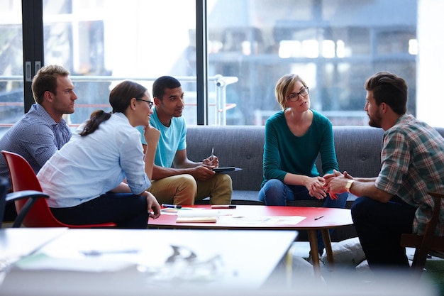 Photo bouncing ideas off each other shot of a creative businesspeople in the office