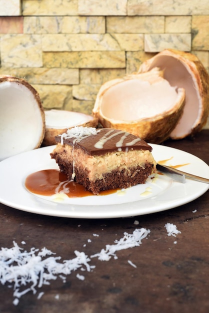 Bounty cake made of fresh coconut on a table