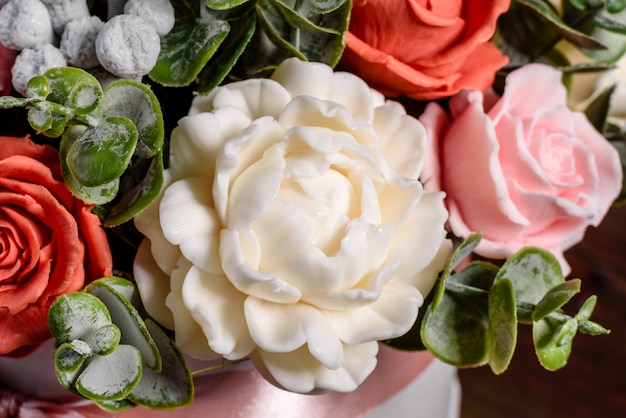 Bouquet of beautiful bright rose flowers in a gift cylindrical cardboard box