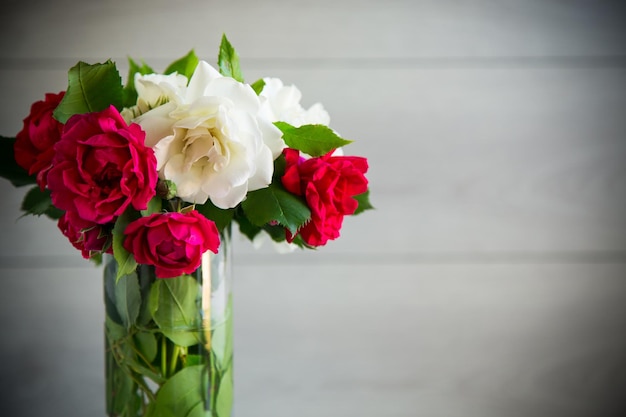 Bouquet of beautiful white and red on a wooden table