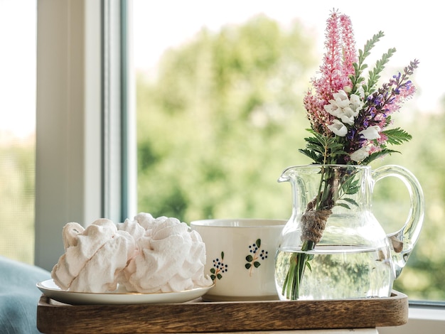 Bouquet of bright flowers standing in a vase