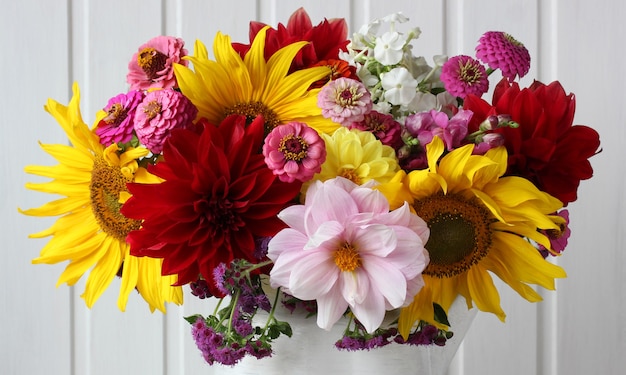 Bouquet close-up as floral background sunflowers dahlias and other garden flowers