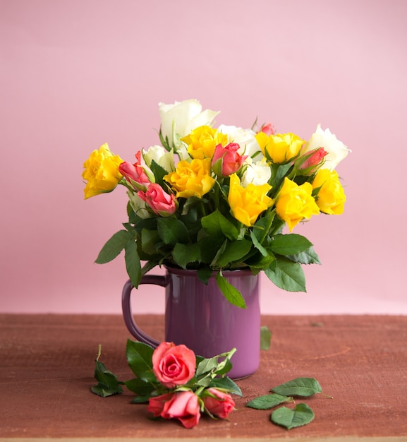 Bouquet of colorful roses in a vase