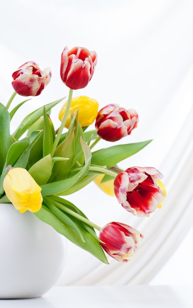 Bouquet of colorful tulips in vase