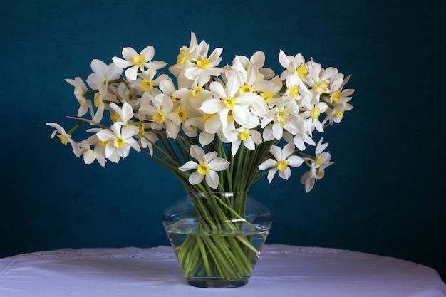 bouquet of daffodils on blue