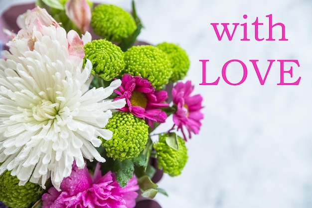 Bouquet of different flowers pink roses and white and green chrysanthemums Valentines day birthday mothers day greeting card with Inscription with Love