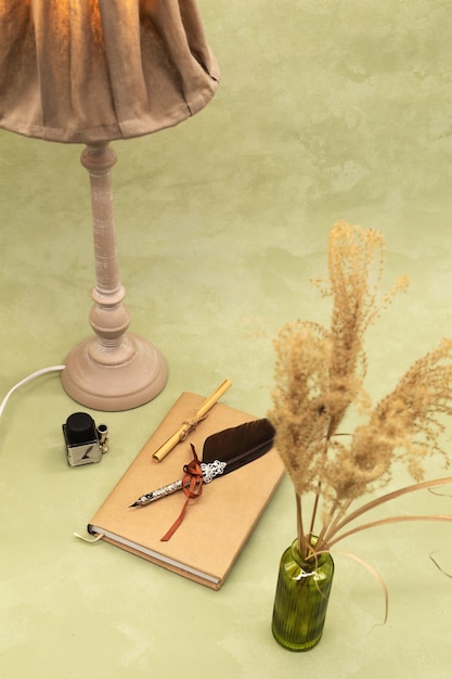 Bouquet of dried flowers in a vase on an olive background in boho style