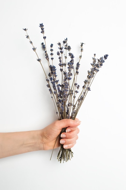 Bouquet of dry flowers in hand.