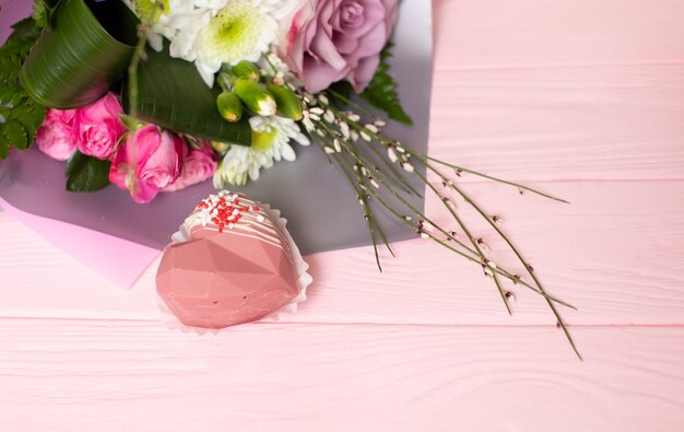 Bouquet of flowers against wooden board