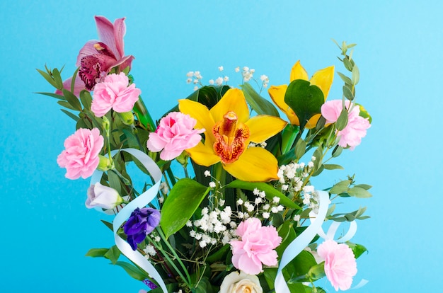 Bouquet of flowers on bright background. 