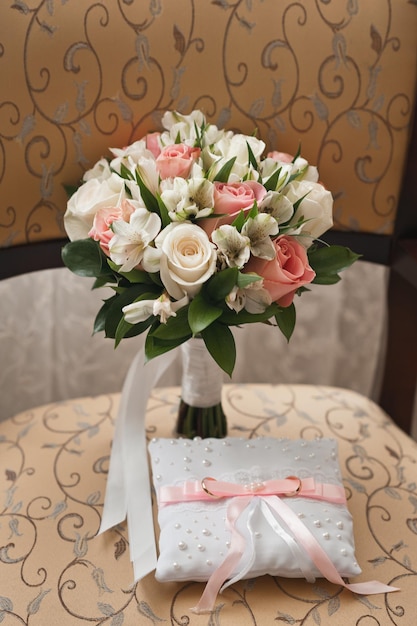A bouquet of flowers on a chair with patterns 4011