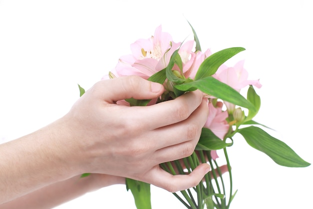 女性の手に花の花束