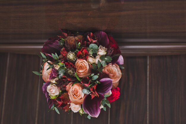 Bouquet of flowers on the floor against the wall 5931