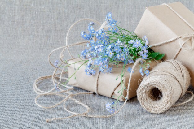 A bouquet of flowers forget-me-nots with gift