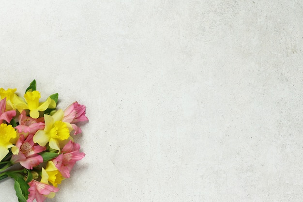 Bouquet of flowers on grey old background