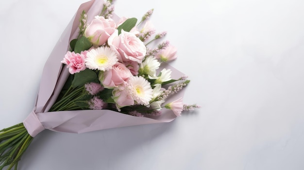 A bouquet of flowers is in a pink wrap.