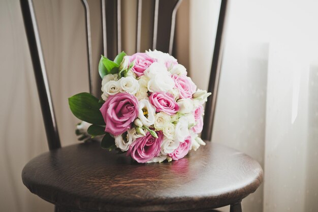 A bouquet of flowers on a stool 6806