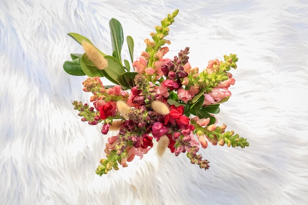 Bouquet of flowers on white blanket