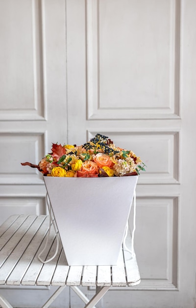 a bouquet of flowers in a white box