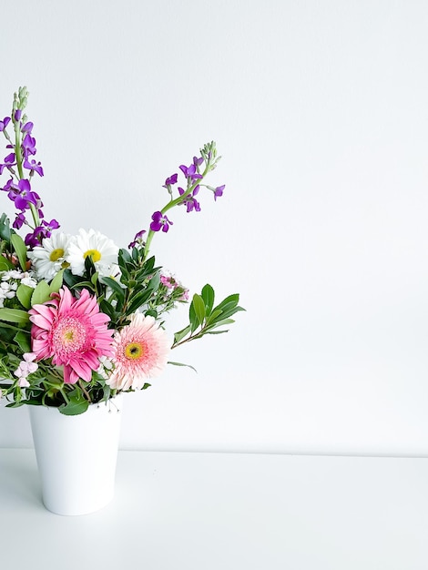 Bouquet flowers in white vase dianthus daylight