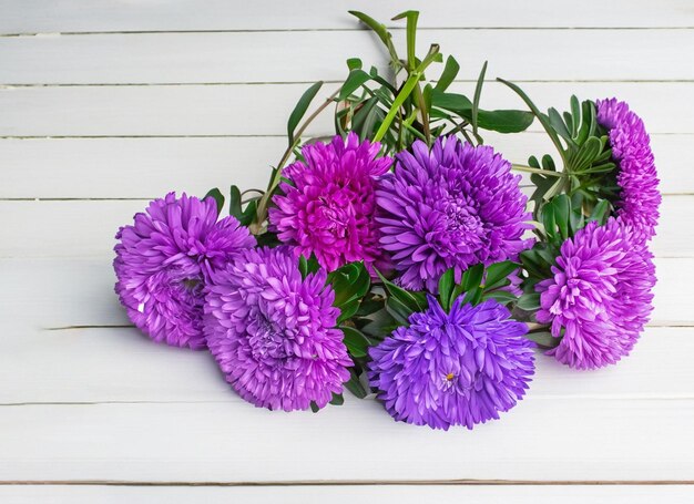 Bouquet of flowers on white wooden table