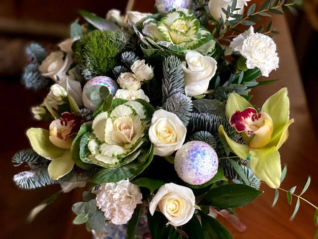 A bouquet of flowers with a green leaf and flowers