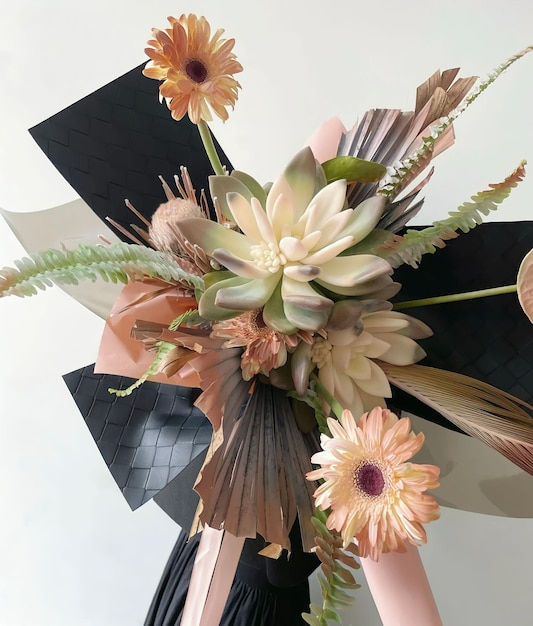 A bouquet of flowers with a large flower in the center.