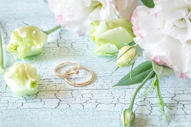 Bouquet of flowers with two gold rings