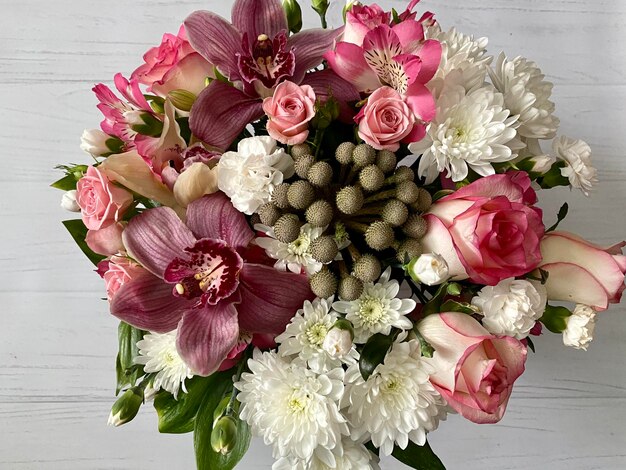 A bouquet of flowers with a white star on the top.