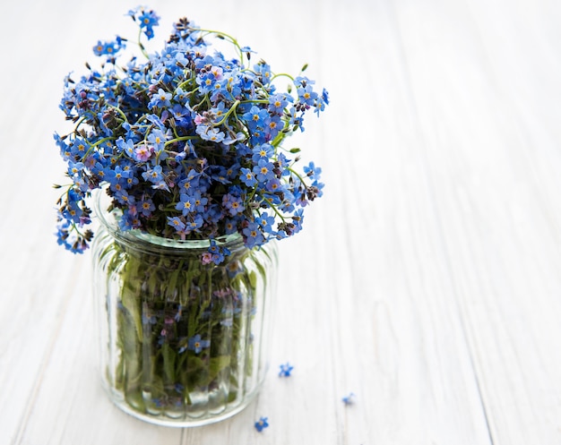 Bouquet of forget me not flowers in the glass vase