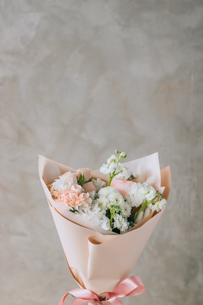 Photo bouquet of freesias, carnations and chrysanthemums and roses