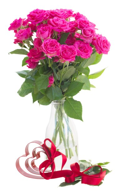 Bouquet of fresh pink rose flowers with heart  isolated on white background