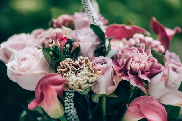 Bouquet from roses and cala lilies