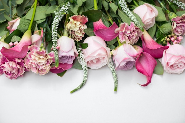 Bouquet from roses and cala lilies