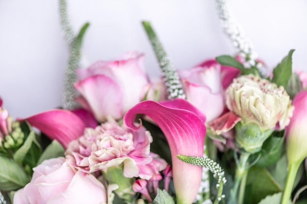 Bouquet from roses and cala lilies