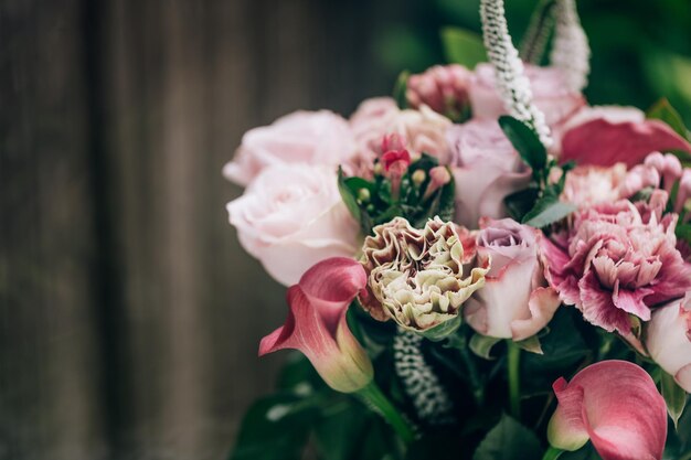 Bouquet from roses and cala lilies