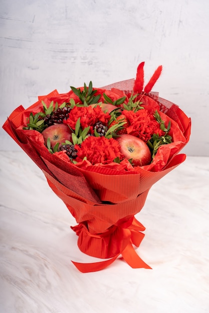 Bouquet of fruits and flowers.