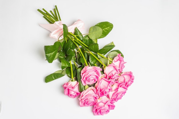 A bouquet of gentle pink roses isolated on white surface