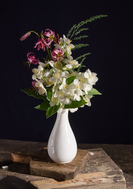 Bouquet of jasmine flowers on a black background, card