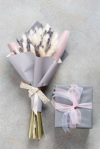 Photo bouquet of lavender and lagurus with gray-purple packaging with a gift box in a single color.