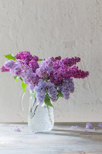 Photo bouquet of lilacs in a glass jug