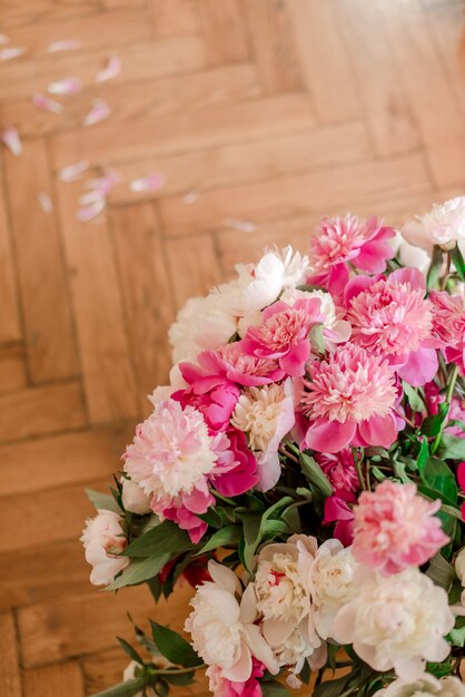 Bouquet of peonies on the floor