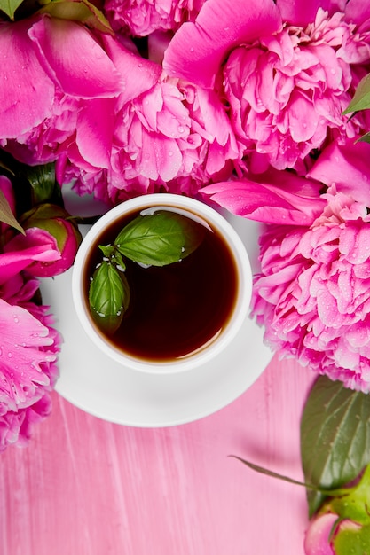 Bouquet Peony flowers and  cup of coffee