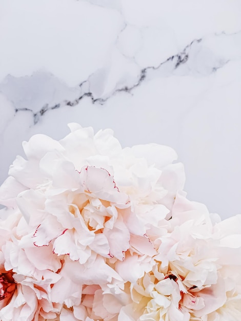 Bouquet of peony flowers on luxury marble background wedding flatlay and event branding