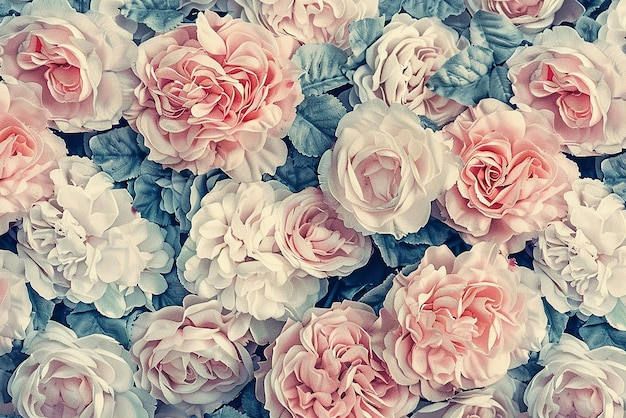a bouquet of pink and blue flowers with a blue background